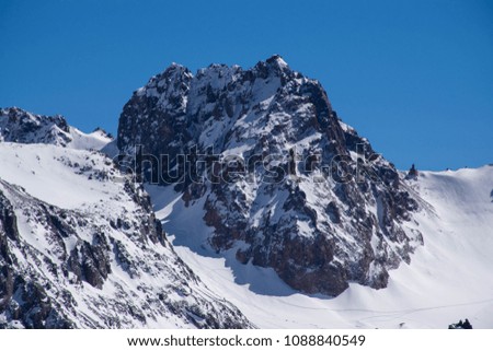 The high severe rocky mountains and glaciers in good weather with the blue sky in Almaty area, Kazakhstan. Tian Shan, Alatau range.