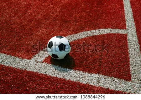 football on red ground, corner