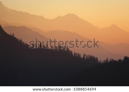 Mountain ranges fade into the distance at sunrise in Nepal