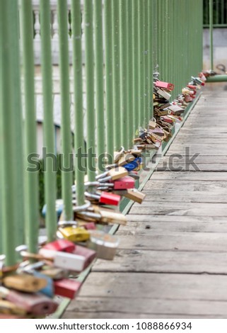 Love padlocks on old pedestrian bridge, low angle view