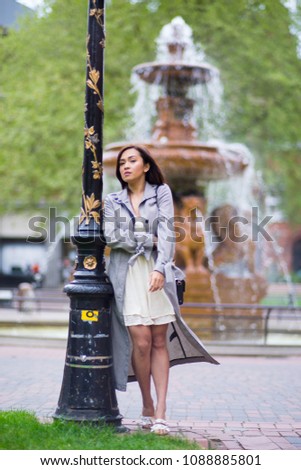 Young Filipino female model around a big city, portrait with blurred backgrounds