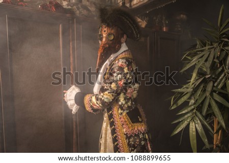 Actor in steam punk masks and antique costumes indoor. 