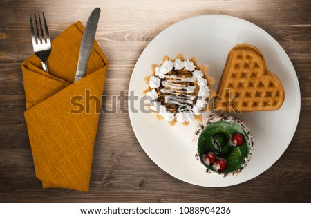 cake on a wooden background. cake on a plate top view
