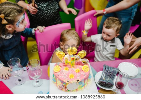 Portrait of happy childs eat a birthday cake. Girls, boys near cake. Kids birthday party decoration. Celebration concept holiday, entertainment.