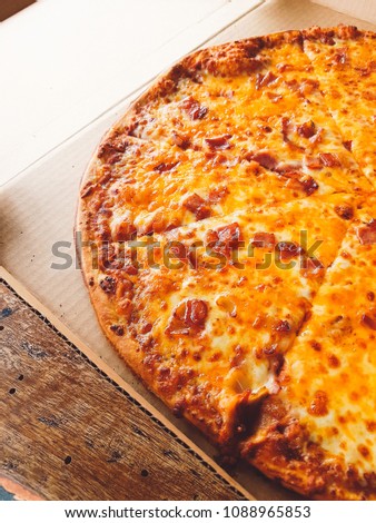 Close up of pizza with cheese and bacon.
