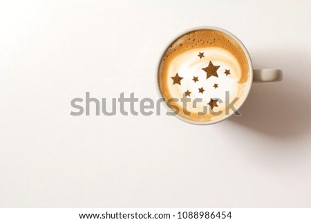 cappuccino in a cup with a picture of stars
