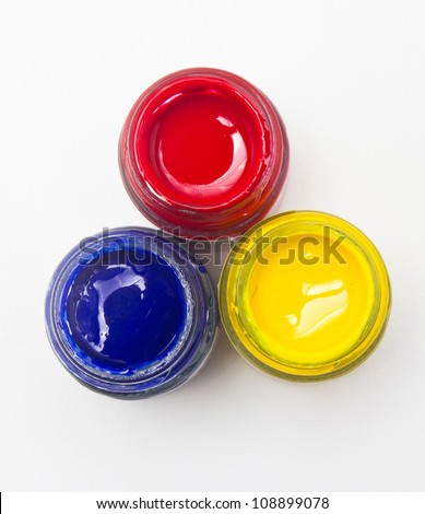 Top view of opened bottles of primary color on white background. Royalty-Free Stock Photo #108899078