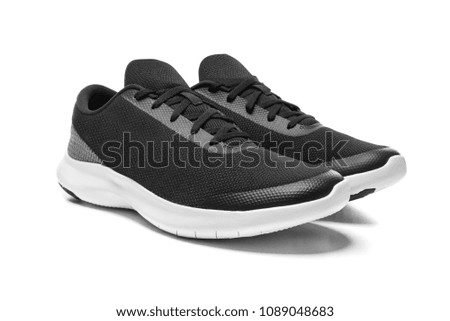 Unbranded modern sneakers isolated on a white background. Black sport shoes.