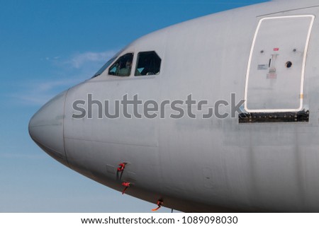 Detail of army airplane nose during sunny weather
