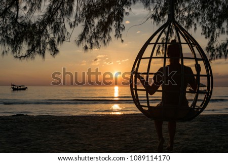 Vacation Sunset on the beach with silhouette