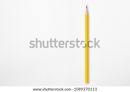 Presentation template with copy space by top view close up macro photo of wooden yellow pencil isolated on white paper that look minimalist and clean.Flash light made smooth shadow from yellow pencil. Royalty-Free Stock Photo #1089270113