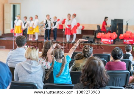 A children's holiday in the kindergarten. Speech of children in the kindergarten in the hall on the stage.