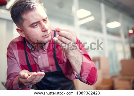 Photo of man with coffee beans in palm