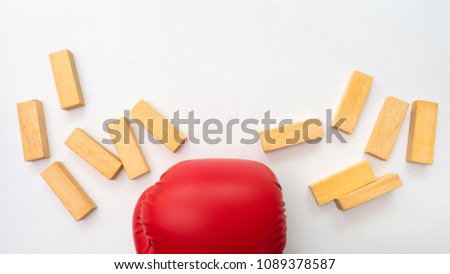 woodblock and red boxing gloves on white background creative concept