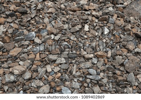 Close-up of gray small stones near the river