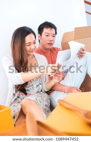 Couple buy a new house. Planing to decorate new home.