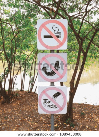 No smoking signage / Fishing prohibited / banned the feeding of animals and fish.