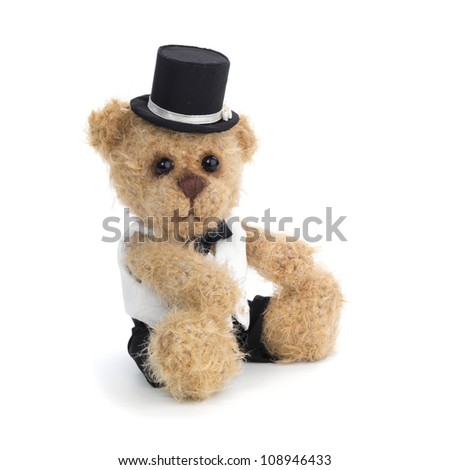 Classic teddy bear gentleman sitting on white