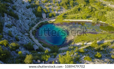The spring of the Cetina River (izvor Cetine) in the foothills of the Dinara Mountain is named Blue Eye (Modro oko). Cristal clear waters emerge on the surface from a more than 100 meter-deep shaft.