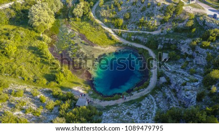 The spring of the Cetina River (izvor Cetine) in the foothills of the Dinara Mountain is named Blue Eye (Modro oko). Cristal clear waters emerge on the surface from a more than 100 meter-deep shaft.