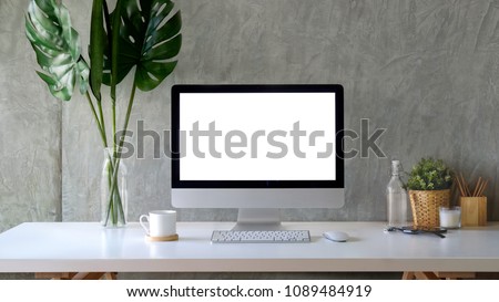 Workspace mockup desktop computer and stuff on white wooden table. Royalty-Free Stock Photo #1089484919