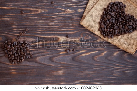 Coffee beans on dark wooden background