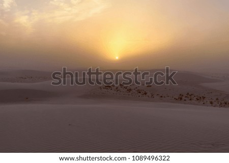 Sunset with blowing wind at White Sands National Monument, New Mexico