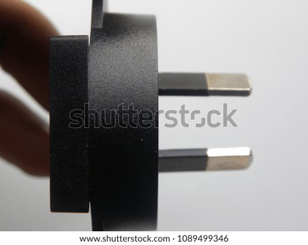 Black color 2 pin power plug adapter on white background