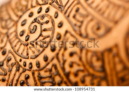 A image showing closeup of a hand with herbal heena using shallow depth of field in wet condition.