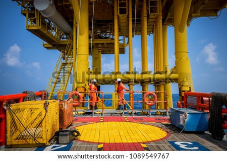 Boat transfer passenger during crew change in oil and gas industry platform. Royalty-Free Stock Photo #1089549767