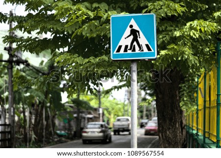 A photo of beware people cross the road sign. 