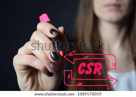 Businessman writes a red marker inscription:CSR