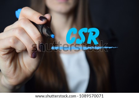 The businessman writes a blue marker inscription:CSR