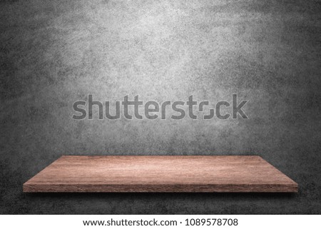 Empty top wooden shelves with grunge cement or concrete wall texture background.Counter for display or montage of product.