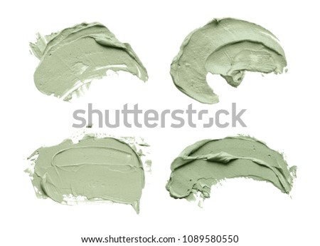 Set of cosmetic mud mask smears isolated on white background. Top view, closeup texture of blue facial clay, copy space Royalty-Free Stock Photo #1089580550