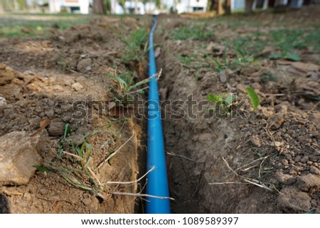 Dig the ground PVC Pipe laying. Royalty-Free Stock Photo #1089589397