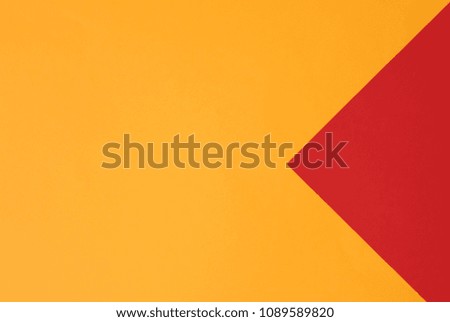 Orange and red pastel color papers geometric flat laying as background and template.
