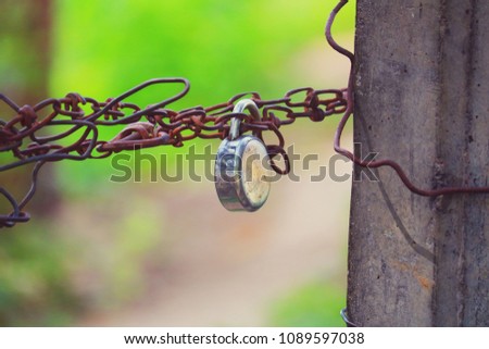 The lock on a chain on a gate