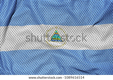 Nicaragua flag printed on a polyester nylon sportswear mesh fabric with some folds