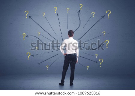 Businessman standing in front lines and question mark signs concept on background