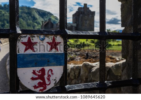 Old rusty Scotland Royal Arm on ancient door of Eilean Donan Castle, Scotland.