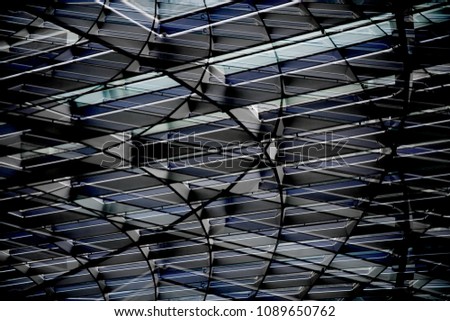 Double exposure photo of structural glazing of roof or ceiling as abstract architecture detail or modern interior design viewed in twilight.