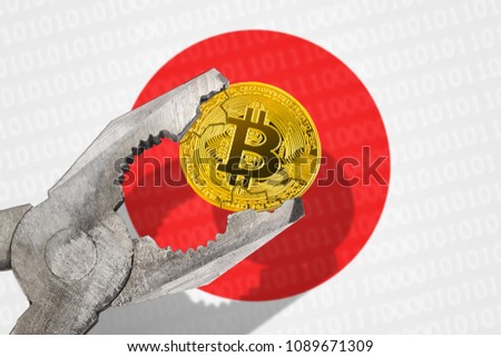 BITCOIN (BTC) coin in a vice under pressure on Japan flag background. Prohibition of bitcoin cryptocurrency; regulations; restrictions or security