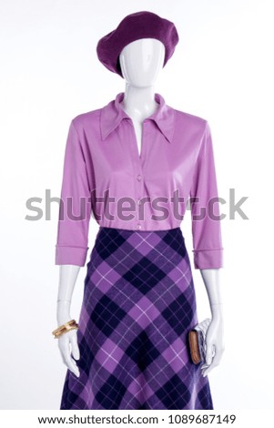 Female mannequin in elegant outfit. Women blouse with collar and skirt. Female elegant clothes and accessories.