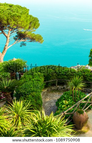 Picture postcard with terrace with flowers and trees,clay pots in the garden Villas Rufolo in Ravello. Amalfi Coast, Campania, Italy