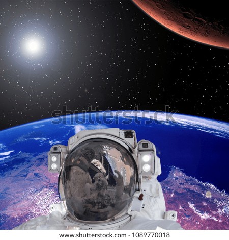 Mission to mars. Earth and astronaut. The elements of this image furnished by NASA.