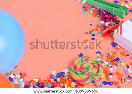 Colorful party frame with birthday objets on orange background. Celebration concept