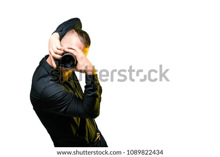 Handsome young photographer on white background