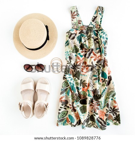 Woman summer clothes travel, collage on white background. Sundress-dress, straw hat, sunglasses. Top view, flat lay. Royalty-Free Stock Photo #1089828776