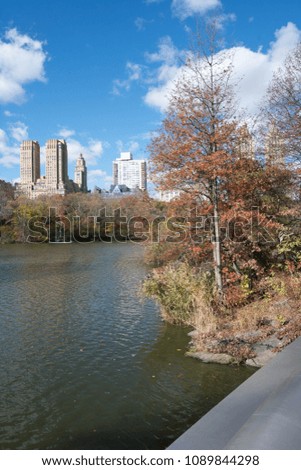 NEW YORK, NY/U.S.A. - NOV. 22, 2015: A view of part of downtown Manhattan from Bow Bridge in Central Park in the fall. 